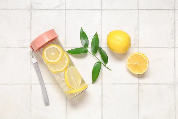 Sports Bottle Infused Water Lemon Leaves White Tile Background — Stock Photo, Image