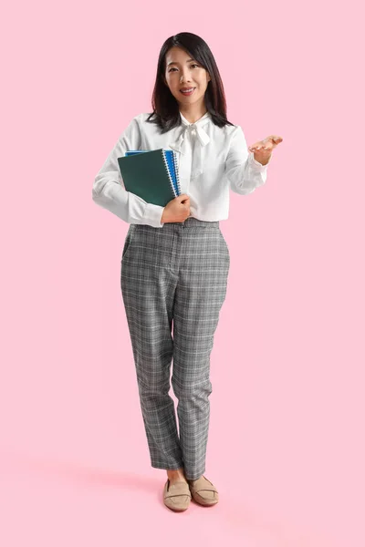 Female Asian Teacher Notebooks Pink Background — Stock Photo, Image
