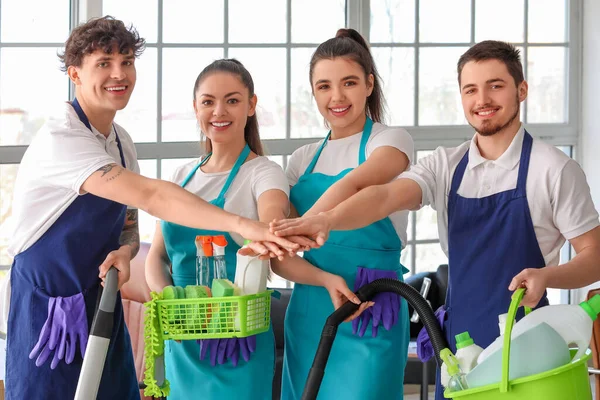 Young Janitors Cleaning Supplies Putting Hands Together Office — Stock Photo, Image