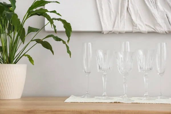 stock image Set of different champagne glasses on wooden countertop, closeup