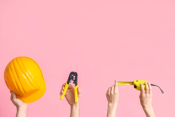 Electrician Hands Tools Hardhat Pink Background — Stok Foto