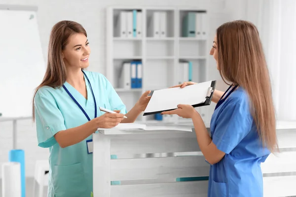 Female Medical Assistants Working Clinic — 스톡 사진
