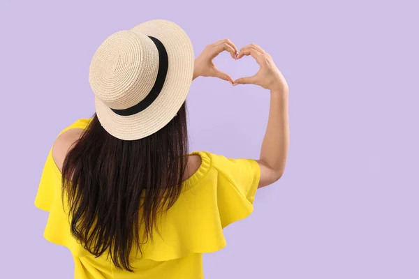 Young Woman Making Heart Her Hands Lilac Background Back View — Stock Photo, Image