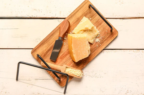 Board Pieces Tasty Parmesan Cheese Light Wooden Background — Stock Photo, Image