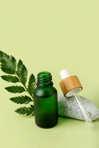 Open Bottle Cosmetic Oil Plant Twig Stone Light Green Background — Stock Photo, Image
