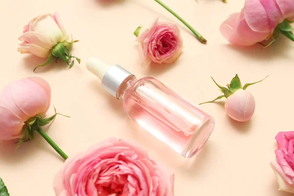 Bottle Cosmetic Oil Rose Extract Flowers Beige Background — Stock Photo, Image