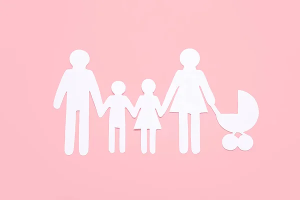 Familienfiguren Auf Rosa Hintergrund — Stockfoto