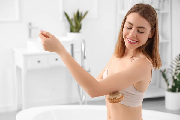 Young Woman Massaging Her Arm Cellulite Brush Bathroom — Stock Photo, Image