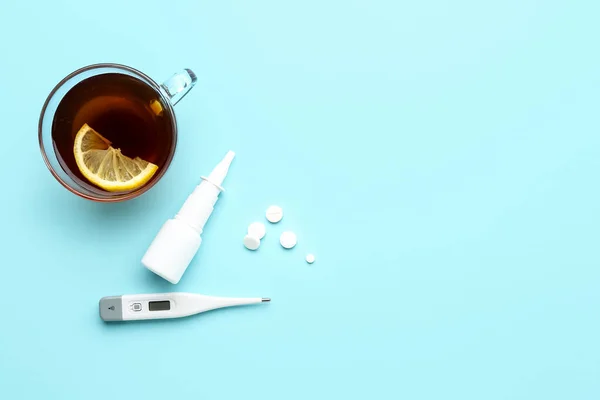 Cup Tea Pills Nasal Spray Thermometer Blue Background — Stock Photo, Image