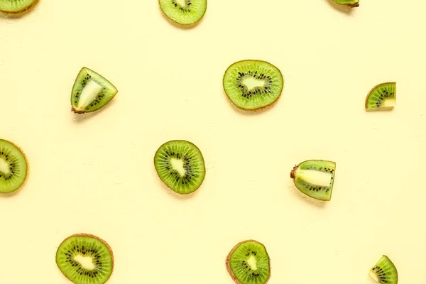 stock image Slices of fresh kiwi on yellow background