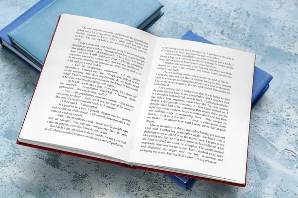 Libro Abierto Sobre Mesa Azul Claro —  Fotos de Stock