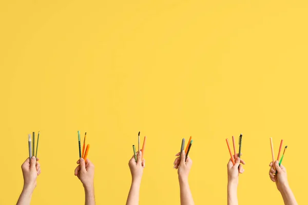 Hands School Supplies Yellow Background — стоковое фото