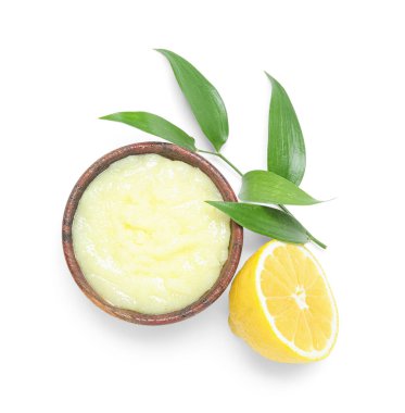 Bowl of lemon body scrub isolated on white background