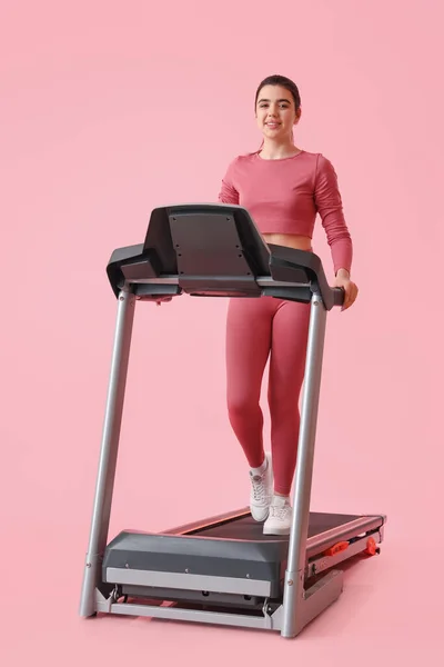 Sporty Young Woman Training Treadmill Pink Background — Stock Photo, Image
