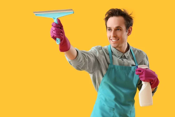Young Man Cleaning Supplies Yellow Background — Stock Photo, Image