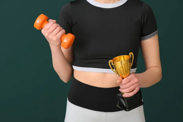 Sporty Young Woman Gold Cup Dumbbell Green Background Closeup — Stock Photo, Image