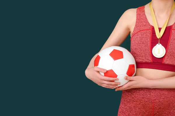 Female Football Player First Place Medal Ball Green Background — Stock Photo, Image