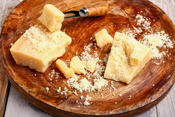 Plate Pieces Tasty Parmesan Cheese Light Wooden Background Closeup — Stock Photo, Image