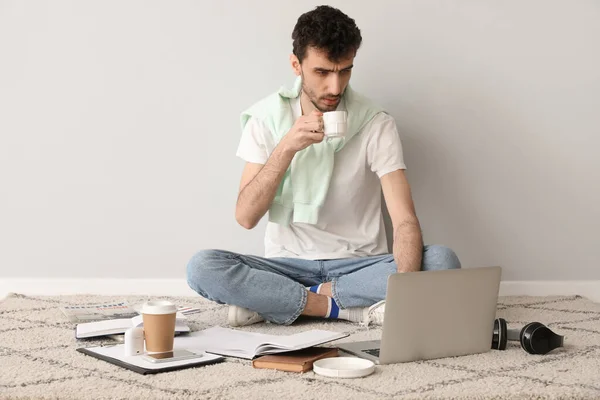 Young Man Cup Coffee Laptop Working Light Wall — Stock Photo, Image