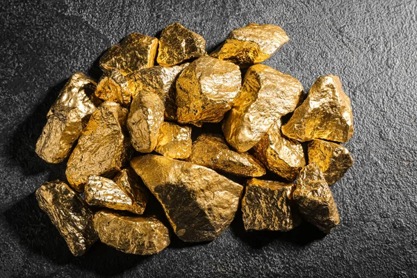 stock image Golden nuggets on dark background