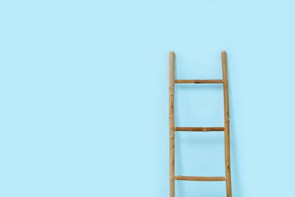 stock image Wooden ladder near blue wall in room