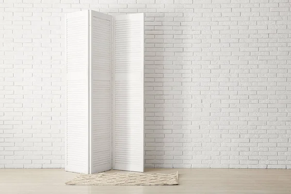 Folding Screen Carpet White Brick Wall — Stock Photo, Image