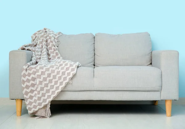 Grey Sofa Cozy Blanket Blue Wall — Stock Photo, Image