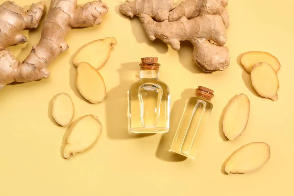 Bottles Ginger Cosmetic Oil Yellow Background — Stock Photo, Image