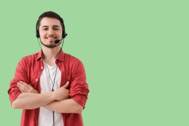 Male technical support agent on green background clipart