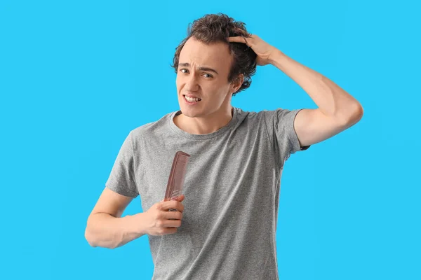 Upset Young Man Comb Losing Hair Blue Background — Stock Photo, Image