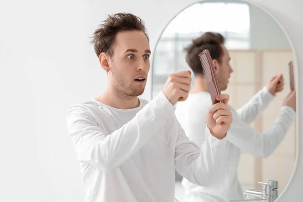 Shocked Young Man Comb Fallen Hair Bathroom — Stock Photo, Image
