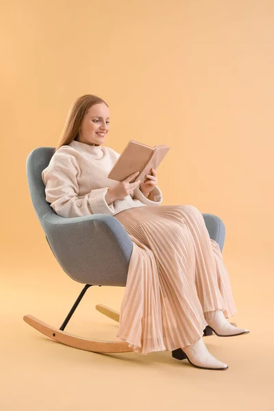 Young Woman Reading Book Armchair Beige Background — Stock Photo, Image