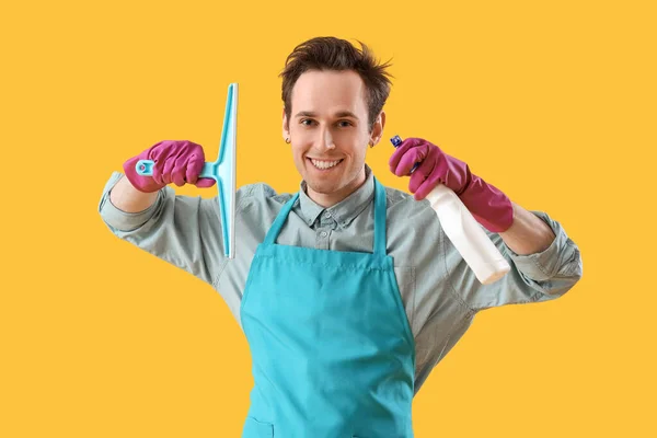 Young Man Cleaning Supplies Yellow Background — Stock Photo, Image