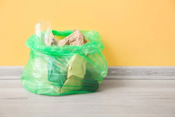 Full Garbage Bag Yellow Wall — Stock Photo, Image