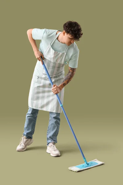 Young Man Mop Green Background — Stock Photo, Image