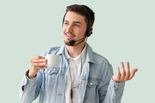 Male Technical Support Agent Coffee Mint Background — Stock Photo, Image