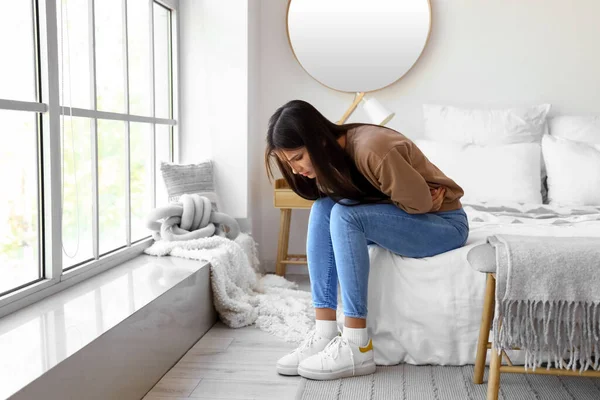 Young Woman Suffering Menstrual Cramps Bedroom — Stock Photo, Image
