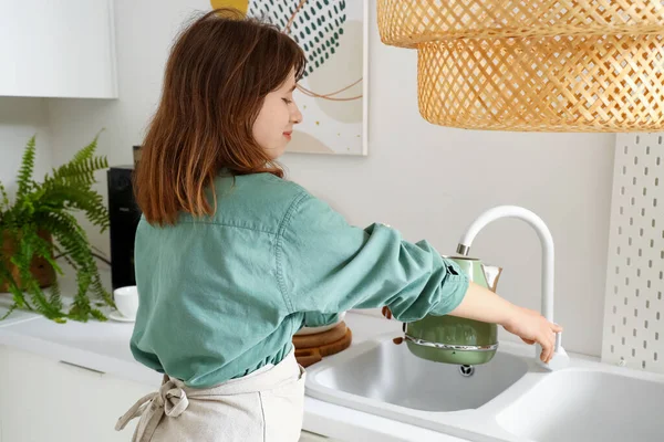 Young Woman Pouring Water Faucet Electric Kettle Modern Kitchen — Stock Photo, Image