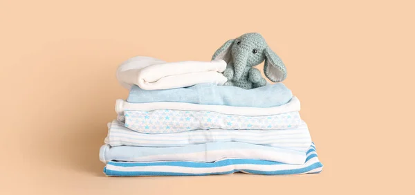 Stack Clean Baby Clothes Funny Toy Beige Background — Stock Photo, Image