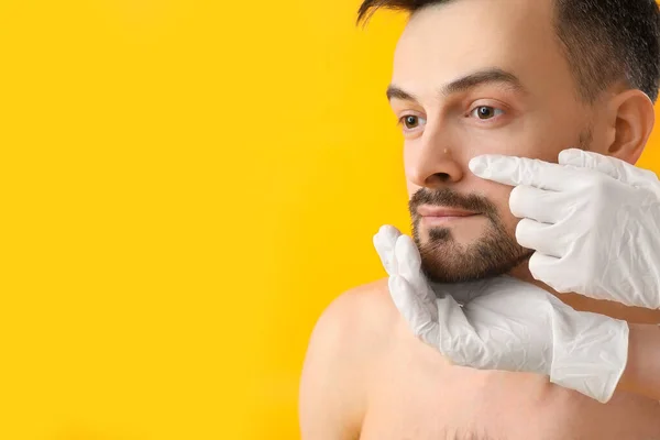 Dermatologist Examining Mole Young Man Yellow Background Closeup — Stock Photo, Image