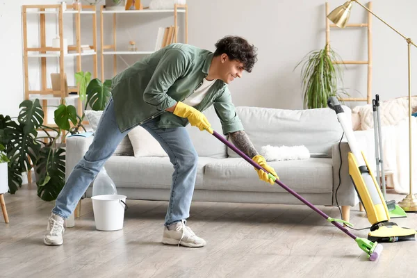 Young Man Mopping Floor Home — Stock Photo, Image