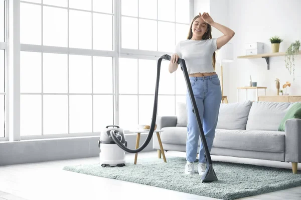 Tired Young Woman Hoovering Carpet Home — Stock Photo, Image