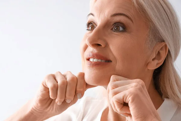 Mature Woman Doing Face Building Exercise Light Background Closeup — Stock Photo, Image