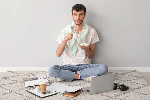 Young Man Cup Coffee Laptop Working Light Wall — Stock Photo, Image
