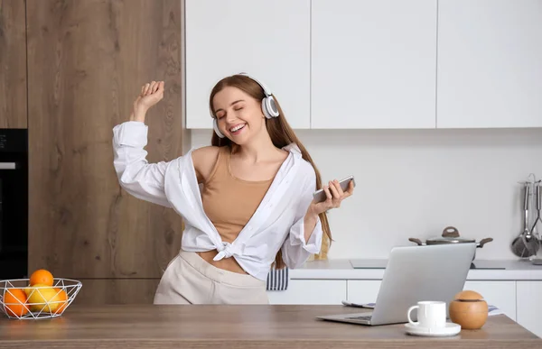 Happy Young Woman Listening Music Dancing Modern Kitchen — Stock Photo, Image