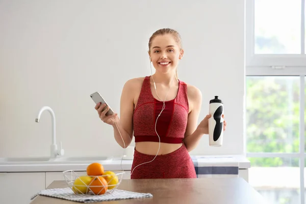 Sporty Young Woman Bottle Water Listening Music Light Kitchen — Stock Photo, Image
