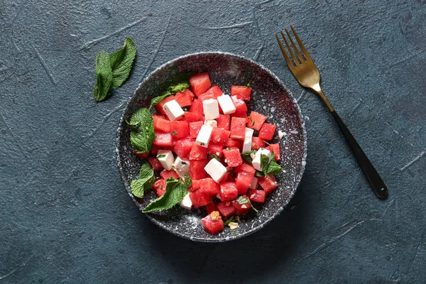 stock image Bowl of tasty watermelon salad on blue background