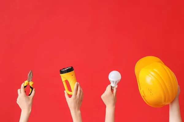 Electrician Hands Tools Light Bulb Red Background — 스톡 사진