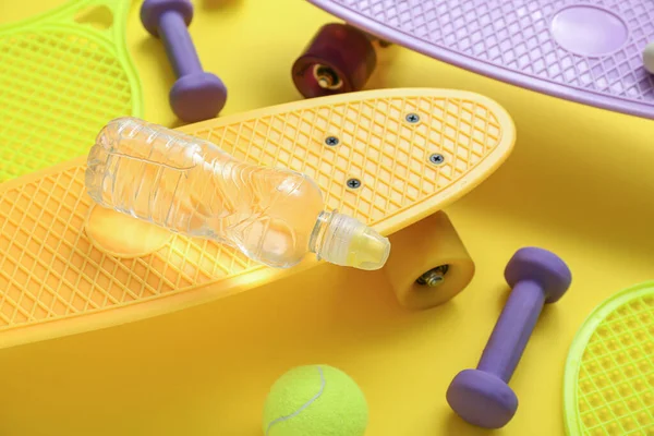Composition Different Sports Equipment Bottle Water Yellow Background Closeup — Stock Photo, Image