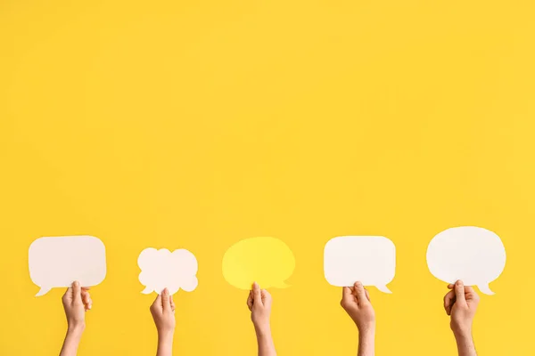 Different Hands Speech Bubbles Yellow Background — Stock Photo, Image